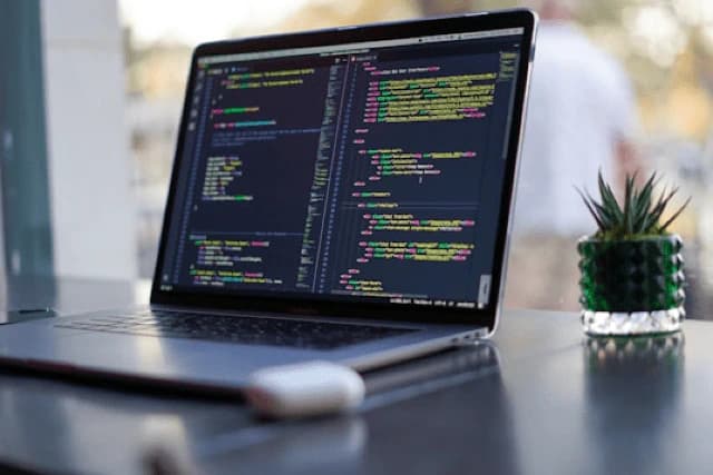 Laptop with code on screen